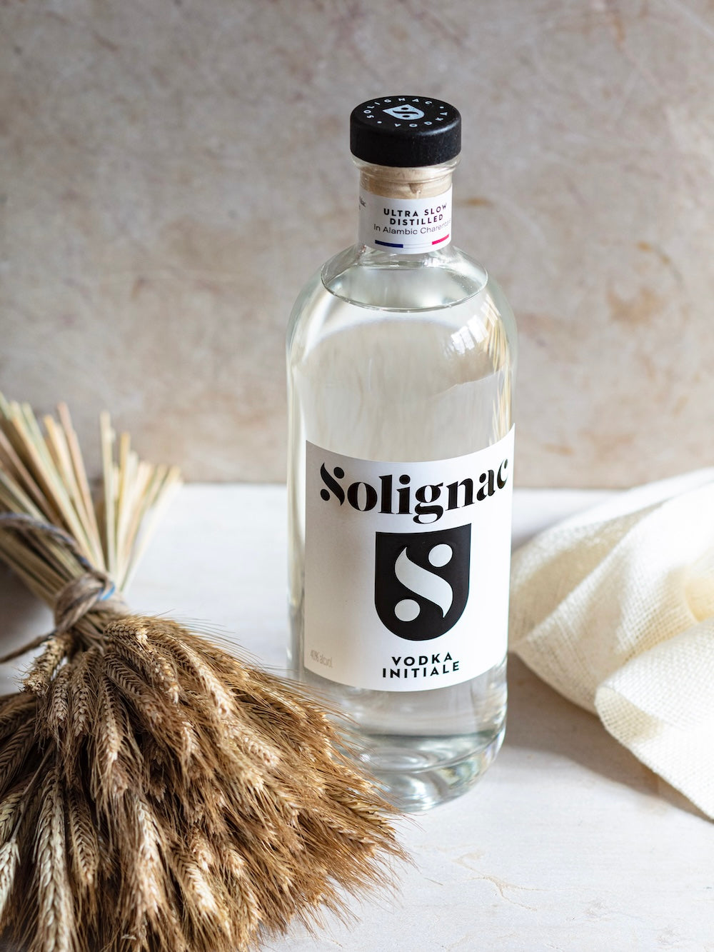 Bottle of Solignac vodka  on a light surface, Vodka initiale by Maison Solignac